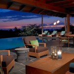 Some Warmth Outdoors Add Some Warmth To Brilliant Outdoors With Tiki Torches With Infinity Pool Design And Green View With Wooden Furntiure Outdoor  Inspiring Outdoor Designs With Tiki Torches 