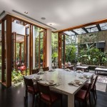 Merryn Road Architects Airy Merryn Road House Aamer Architects Dining Room Connected With Deck Functions As Seating Space Exterior  Impressive Compact House Covered With Green Plants Exterior 