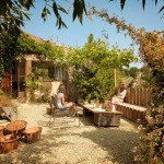 Outdoor Living Of Amazing Outdoor Living Space Design Of French Riviera Hotel With Soft Brown Colored Wooden Couch And Soft Brown Wooden Table Decoration  Traditional Cottage Theme And Ideas Embraced By Nature 