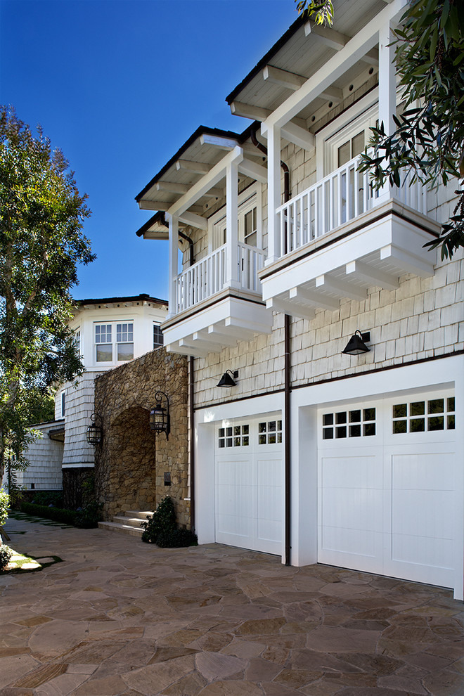 Malibu Residence Design Appealing Malibu Residence David Phoenix Design Exterior With White Garage Abd Shed Door Also Exposed Stone Wall Decoration  Outstanding Traditional Seaside House In Bright White Decoration 