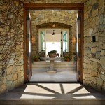 Entry Design Stone Astonishing Entry Design With Exposed Stone Wall And Wooden Door At Malibu Residence David Phoenix With Concrete Floor Decoration  Outstanding Traditional Seaside House In Bright White Decoration 