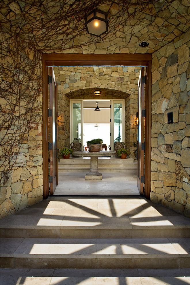 Entry Design Stone Astonishing Entry Design With Exposed Stone Wall And Wooden Door At Malibu Residence David Phoenix With Concrete Floor Decoration  Outstanding Traditional Seaside House In Bright White Decoration 