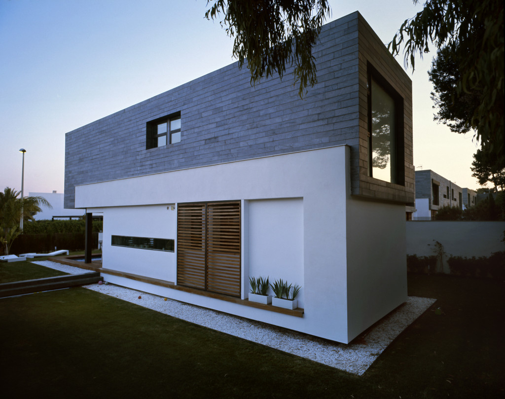 Detached House Panel Awesome Detached House With Glass Panel Covered With Wooden Shutter As Main Entrance Door Also White Exteriro Wal With Concrete Brick For Second Floor House Designs  Contemporary Home Design Demonstrating Neutral Color Palette 