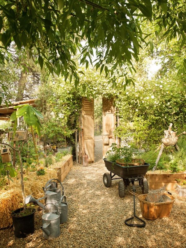 Garden Design Riviera Awesome Garden Design Of French Riviera Hotel With Black Colored Pulling Cart And Several Silver Water Can Made From Metal Decoration  Traditional Cottage Theme And Ideas Embraced By Nature 