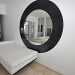 China Blanca Mirror Casa China Blanca With Circle Mirror In Metal Framework With White Mattress And Leather Pillow In White Pounded Concrete Wall And Orange Square Floor Decoration Luxury Modern Villas With White Color Design Ideas