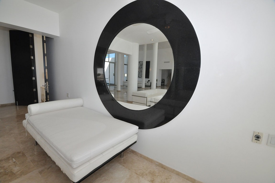 China Blanca Mirror Casa China Blanca With Circle Mirror In Metal Framework With White Mattress And Leather Pillow In White Pounded Concrete Wall And Orange Square Floor Decoration Luxury Modern Villas With White Color Design Ideas