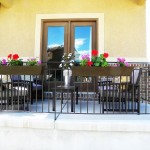 Flowers Placed Tidy Colorful Flowers Placed In The Tidy Balcony Planters On Long Iron Handrail Near Dark Chairs And Black Table Decoration  DIY Planters Enhancing Fresh Decoration In Your Room 