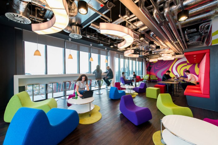 Touches For Interior Colorful Touches For Google Office Interior Design With Stylish Seating Units And Rounded White Tables To Match With Decorative Chandeliers Office  Updated Office In Uplifting Design 