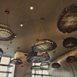 Don Cafe Chandelier Delightful Don Cafe House With Chandelier Lamps With Rattan Lampshade Also Concrete Ceiling With Stage Lamps Also Wavy Interior Wall Veneer House Designs  Cafe Interior Design With Calming And Relaxing Vibe 