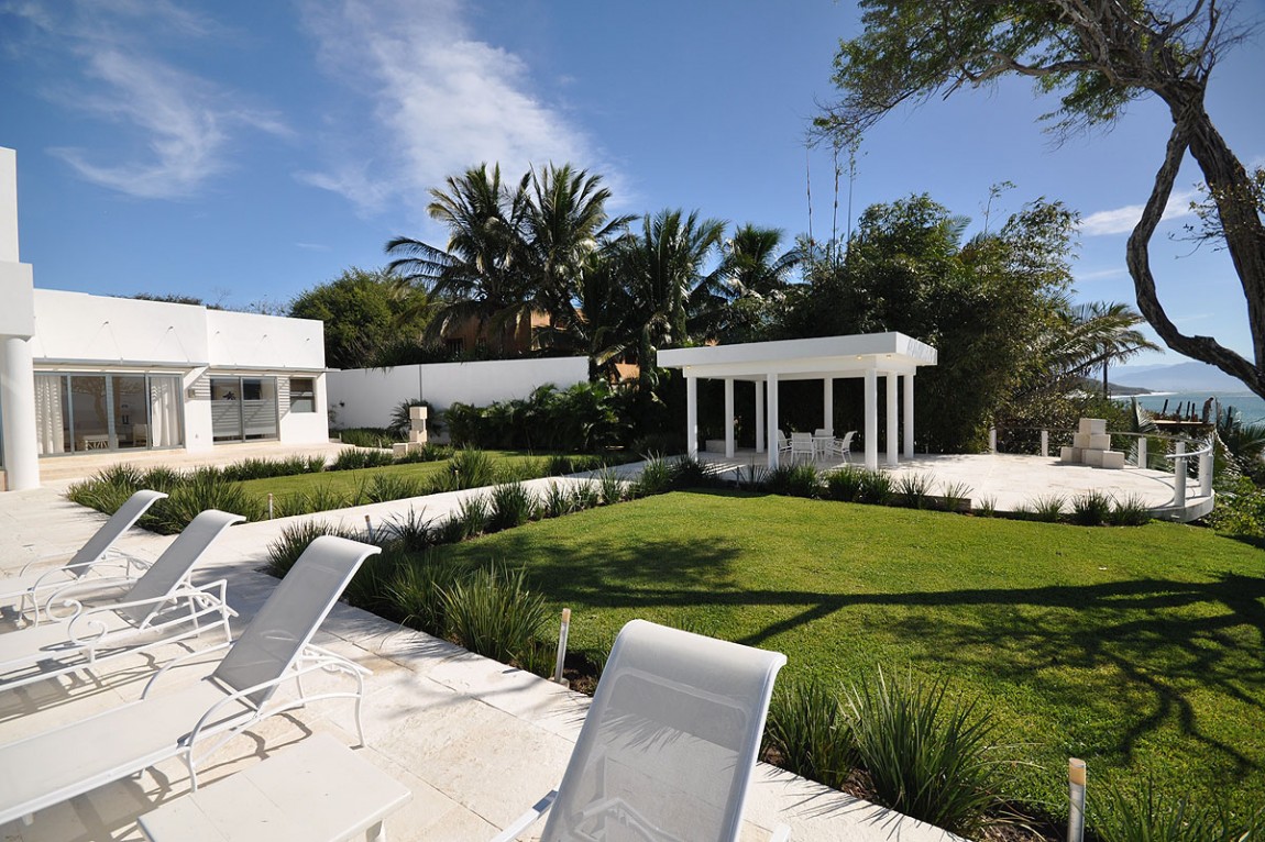 Casa China White Exotic Casa China Blanca With White Wooden Lounge Chair Near Concrete Pathways Between Green Garden And White Gazebo With White Table And Chairs Decoration Luxury Modern Villas With White Color Design Ideas
