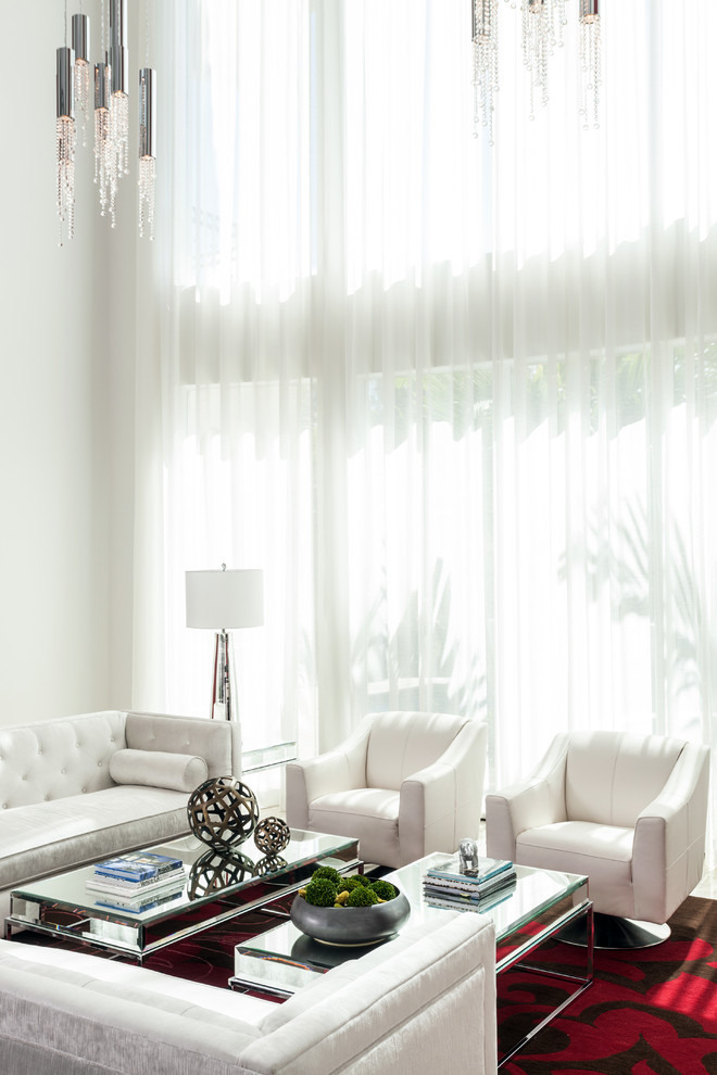 Living Room With Fancy Living Room Interior Furnished With White Sofas Also Books On Table And Floor Lamp On Floor Near Bay Windows Covered With Transparent Curtain Decoration  Exclusive Modern Glamour House With The Application Of Bold Colours 