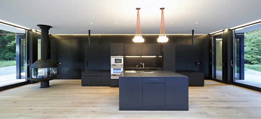 Kitchen View Haus Fascinating Kitchen View Inside Project Haus Hainbach Moosmann With Wide Island And Bright Lights Near Black Drawers Decoration  Fresh Open Space House With Glass And Wooden Design 