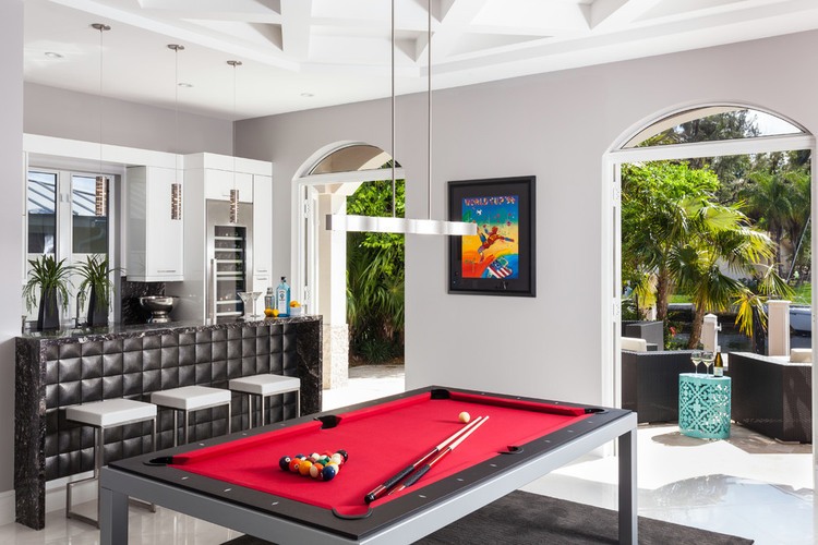 Playing Room Billiard Fascinating Playing Room Furnished With Billiard Table Under Pendant Lamps Near Kitchen Bar Also White Stools On Floor And Painting On Wall Decoration  Exclusive Modern Glamour House With The Application Of Bold Colours 