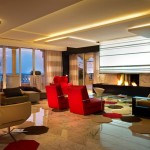 In The With Fireplace In The Living Room With Red Sofas And Wide Glass Table On Unsual Carpet Tiles Interior Design  Carpet Tiles With Bright Color For Interior House 