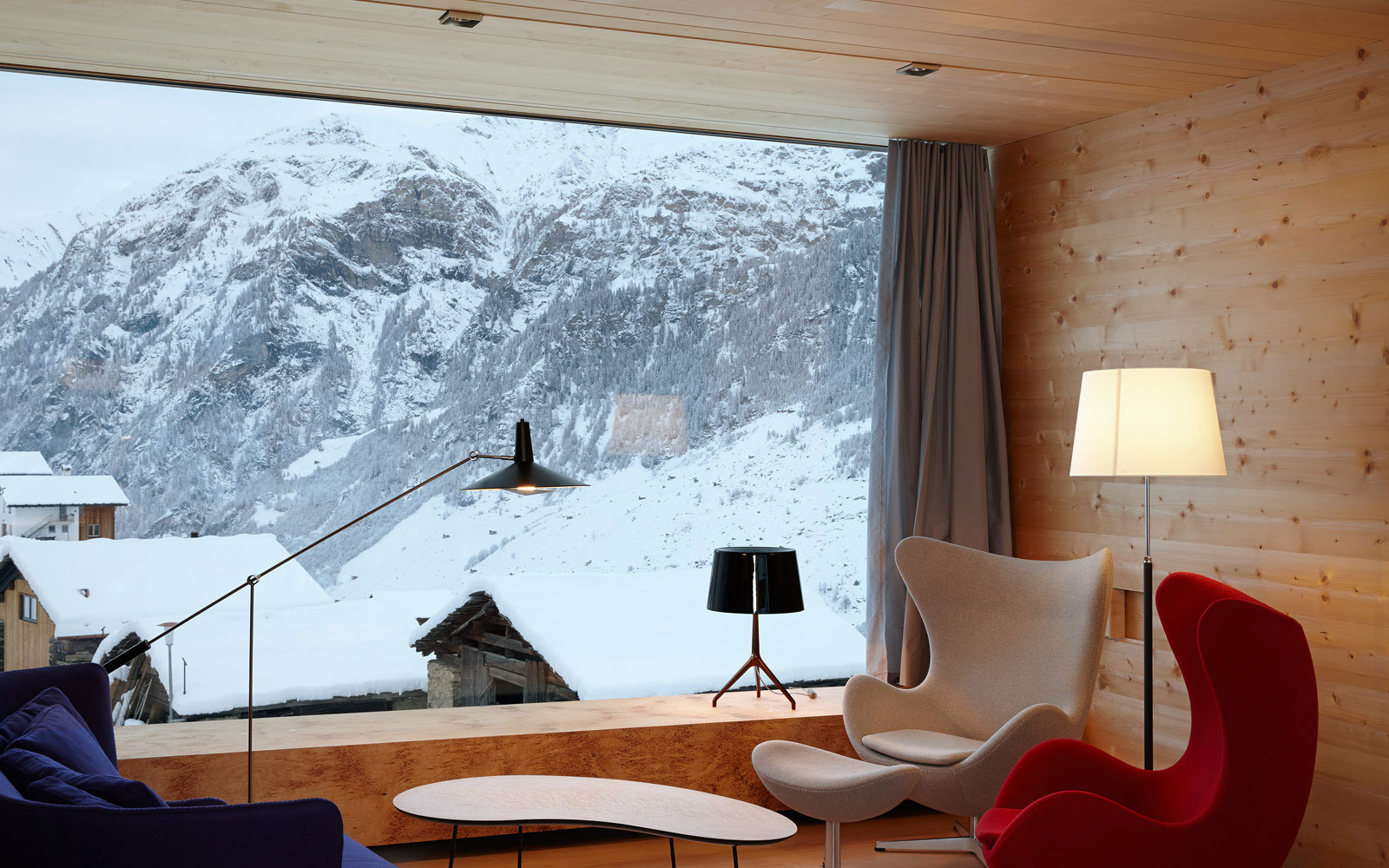 Living Room Zumthor Impressive Living Room Design Of Zumthor Vacation Homes With Colorful Chair And Glass Window With Snow Mountain Scenery House Designs  Simple Wooden Interior From Zumthor Vacation Home 