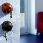 Shape Of Key Interesting Shape Of The Thing Key Holder Placed On The White Concrete Wall Near The Red Sofa Decoration  Key Holder Designs For Your Complete Excitement 