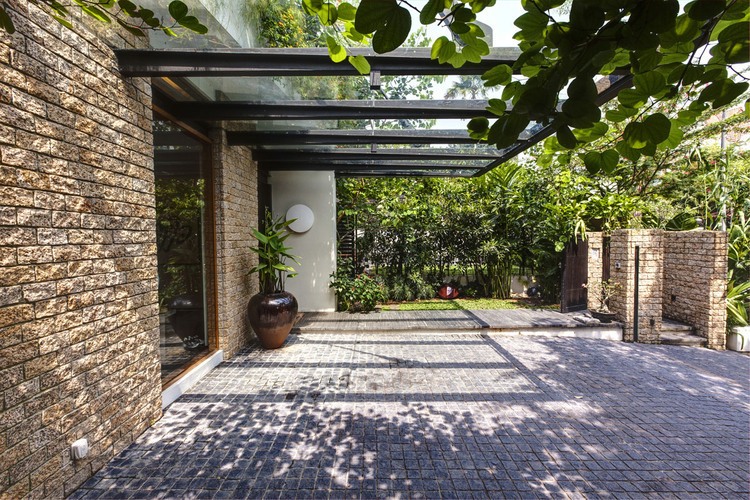 Merryn Road Architects Inviting Merryn Road House Aamer Architects Terrace For Carport Or Walking Under Glass Cantilever Set  Impressive Compact House Covered With Green Plants Exterior 