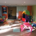 Play Room Toys Kids Play Room With Colorful Toys And Pink Table Set On Brown Carpet Tiles In Homes House Designs  Carpet Tiles In Homes Interior Decoration 