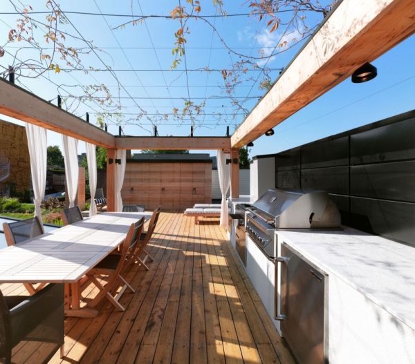 White Barbeque Under Long White Barbeque Countertop Placed Under Wide Pergola In White Canvas On A Green Roof Residence Terrace Garden  Roof Garden Brings Harmony Sensation In Montreal 
