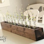 Wooden Table On Long Wooden Table Centerpiece Placed On White Table Inside Cozy Dining Room With The White Chairs Decoration  DIY Planters Enhancing Fresh Decoration In Your Room 