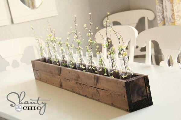 Wooden Table On Long Wooden Table Centerpiece Placed On White Table Inside Cozy Dining Room With The White Chairs Decoration  DIY Planters Enhancing Fresh Decoration In Your Room 
