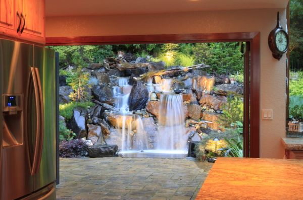 View From To Marvelous View From Kitchen Side To Backyard Area With Stoney Artificial Waterfall With Clean Water Flowing From Upper Ground To Pond Garden  Backyard Garden Waterfalls As Beautiful Garden Landscaping 