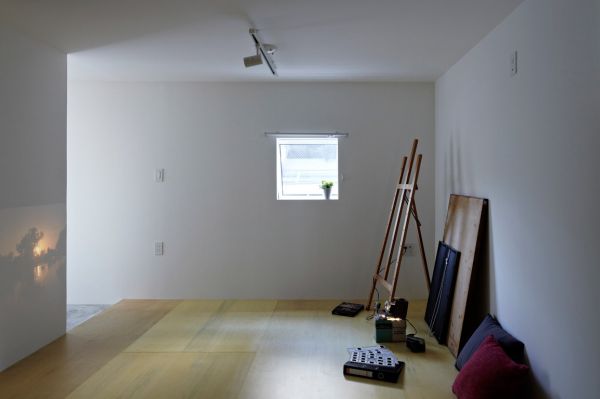 Studio Room Japan Minimalist Studio Room Located Inside Japan Cube House With Wooden Floor And Fluffy Throw Pillows Near White Wall Architecture  Modern Simple House In Ecological Building Construction 