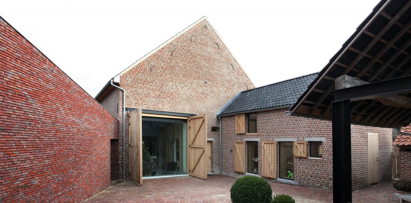 House Dm Brick Natural House DM Design With Brick Piles Construction And Smaller Hose In Front With Wooden Door With Green Plants In Terrace Architecture  Converted Home Project In Contemporary Style Designs 