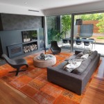 Carpet Tiles Family Orange Carpet Tiles In The Family Room With Long Sofa And Grey Chairs Above It Interior Design  Carpet Tiles With Bright Color For Interior House 