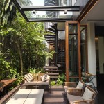 Look Of House Shady Look Of Merryn Road House Aamer Architects Deck Covered By Glass Cantilever Over The Brown Sofa Exterior  Impressive Compact House Covered With Green Plants Exterior 