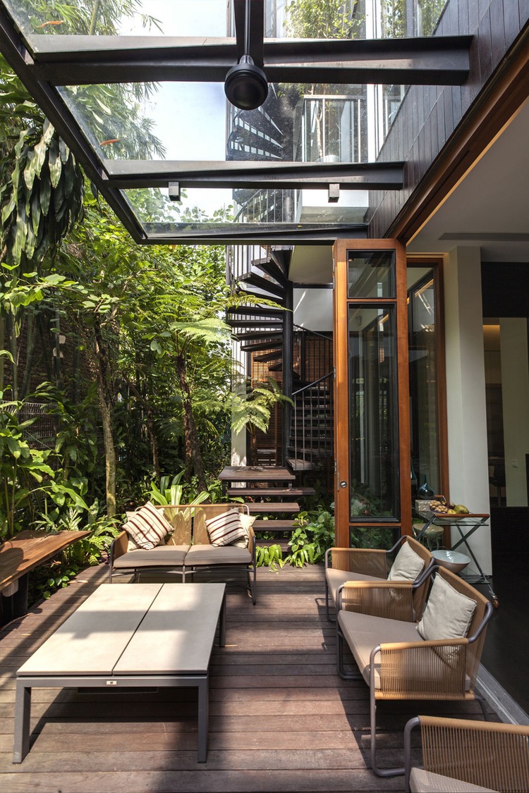 Look Of House Shady Look Of Merryn Road House Aamer Architects Deck Covered By Glass Cantilever Over The Brown Sofa Exterior  Impressive Compact House Covered With Green Plants Exterior 