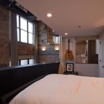 Bedroom In Loft Small Bedroom In West Loop Loft Second Level Floor With White Duvet Cover And Grey Pillows And White Night Lamp Interior Design  Rustic Interior Design Intended To Make Mild Atmosphere 