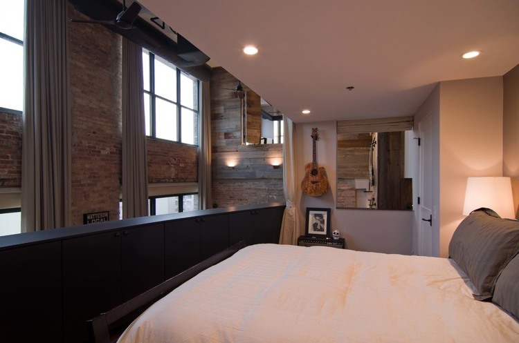 Bedroom In Loft Small Bedroom In West Loop Loft Second Level Floor With White Duvet Cover And Grey Pillows And White Night Lamp Interior Design  Rustic Interior Design Intended To Make Mild Atmosphere 