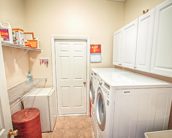 Laundry Room Furniture Small Laundry Room With White Furniture And Wire Open Shelving Unit Matched With Cream Wall Painting And Stained Flooring Decoration  Contemporary House Designs In Inside And Outside 