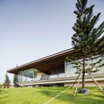 Grand Pinklao Design Stunning Grand Pinklao Clubhouse Officeat Design Exterior With Large Green Lawn And Pine Tree Shown Also Suspended Terrace Architecture Stylish Cantilever House Design Built Among Expansive Green Yard