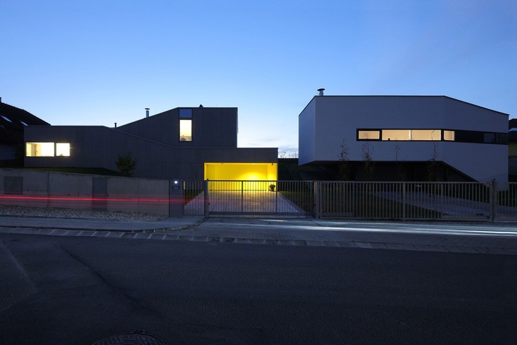 House K2 View Stunning House K2 Pauliny Hovorka View At Night From Across The Street Displayed Metal And Concrete Fence House Designs  Modern Interior Design From A House With Minimalist Furnishing 