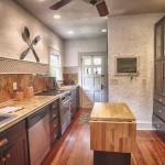 Kitchen Of In Stylish Kitchen Of Historic Home In DeLand Florida Completed With Stunning Interior With Wooden Floor And Island Decoration  Artistic Concrete Wall Applying Textured Wall Design 