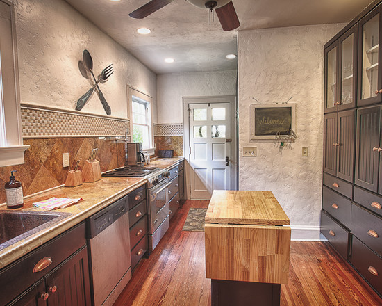 Kitchen Of In Stylish Kitchen Of Historic Home In DeLand Florida Completed With Stunning Interior With Wooden Floor And Island  Artistic Concrete Wall Applying Textured Wall Design 