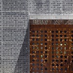 Perforated Building And Unique Perforated Building Silver Wall And Brown Wooden Entrance Door With Dream Downtown Hotel Letter Upper Placement Architecture  Amazing Hotel Building With Metal Panels 
