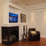 Family Room At Warm Family Room With Fireplace At Wall Edge With Wall Mount TV Above Featured With Elegant Leather Sofa With Cream Pillow Exterior  Large Heritage Home With Red Exterior 