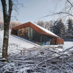 Board Combined On Wooden Board Combined With Glass On The Wall Construction Decoration  Modern House Design In A Sloping Snowy Area With An Opened Concept 