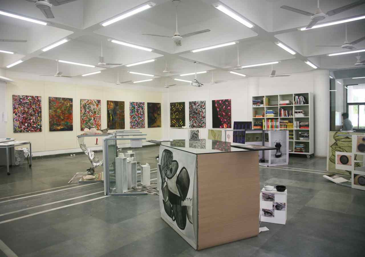 Artistic Interior With Admirable Artistic Interior Design School With Ceiling Fans And Lighting Decorated With Wall Paintings Also Furnished With Bookcase Cabinets And Desk Interior Design 15 Captivating Interior Design Schools With Vibrant And Colorful Interiors