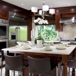 Contemporary Kitchen With Adorable Contemporary Kitchen Decorating Ideas With White Kitchen Island Completed With Dining Fixtures And Modern Chandelier Plus Furnished With High Chairs Kitchen An Interesting Kitchen Decorating Ideas
