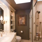 Minimalist Bathroom Lighting Adorable Minimalist Bathroom With Bathroom Lighting Fixtures Installed With Shower Room Applying Clear Glass Door Completed By Shower Head And Furnished With Vanity Sink Bathroom The Greatnesses Of Bathroom Lighting Fixtures