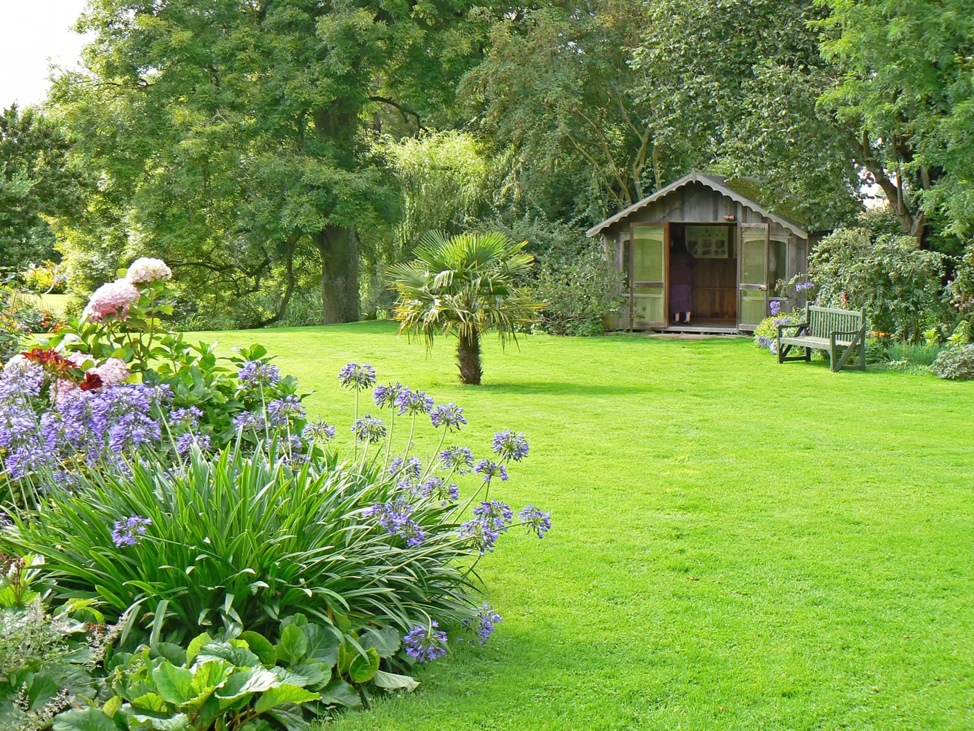 Neat Green Garden Amazing Neat Green Grass Of Garden Design Ideas Furnished With Various Plants Completed With Green Bench And Contemporary Garden Shed Garden Garden Design Ideas As The Additional Decoration For Enhancing House