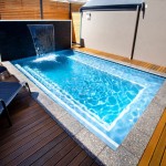 Small Swimming Water Amazing Small Swimming Pool With Water Wall Idea Plus Decking Floor Design And Cozy Black Lounge Chairs Pool  Making Small Swimming Pool In Best House 