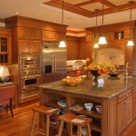 Wooden Kitchen Island Appealing Wooden Kitchen Design With Island Furnished With Sink Plus Pendant Lighting Also Completed With Refrigerator And Ovens On Cupboard Kitchen Kitchen Designs With Islands: Modern Kitchen Setting