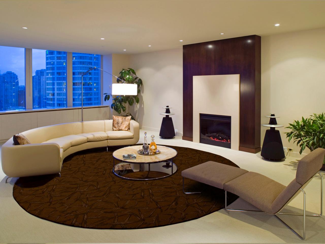 Minimalist Living Round Astonishing Minimalist Living Room In Round Design With White Sofa And Round Table On Dark Brown Circle Living Room Rugs Also Furnished With Gray Sleeper Chair How To Choose Special Living Room Rugs