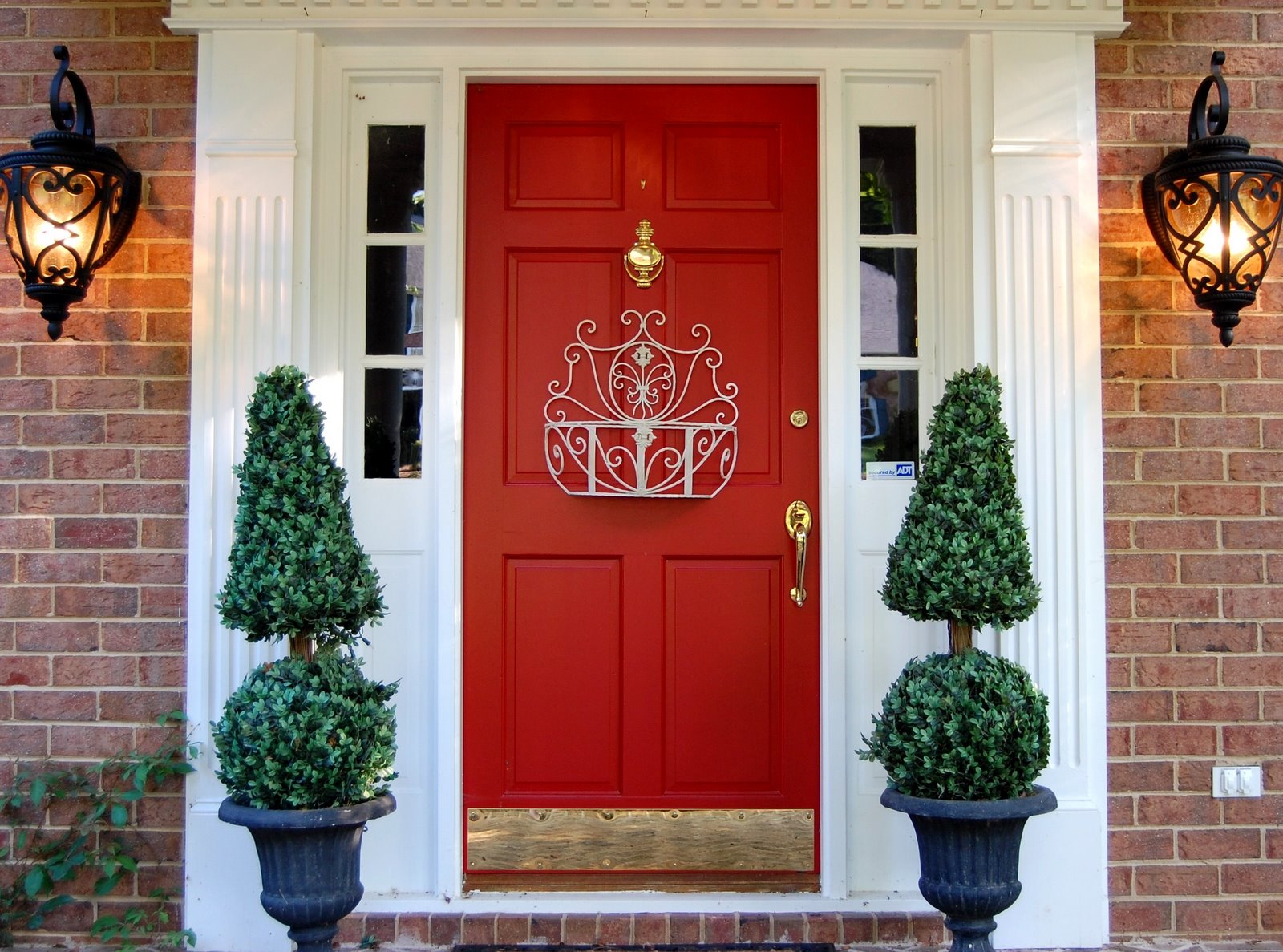 White Red Red Astonishing White Red Entrance With Red Front Door Ideas Applying Door Knocker Also Lever In Golden Color Furnished With Green Trees And Decor And Completed With Wall La Exterior Front Door Ideas: The “Face” Of The House