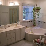 Bathroom Using Ideas Awesome Bathroom Using White Furniture Ideas And Bathroom Lighting Fixtures Completed With Corner Bathtub And Vanity Double Sink Furnished With Large Mirror Bathroom The Greatnesses Of Bathroom Lighting Fixtures